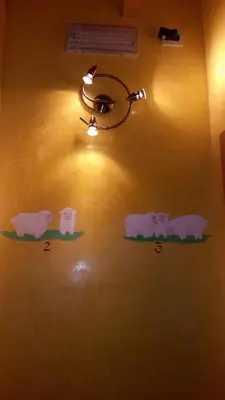 a wall with animals painted on the wall at Chalet Heidi in Arabba