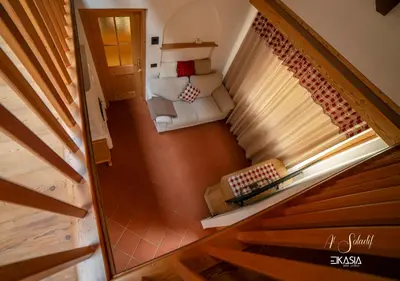 an overhead view of a staircase in a tiny house at Al Soladif - Mansarda con vista in Cavalese