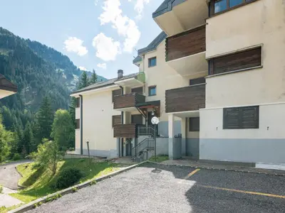 a snow covered slope with a ski lift on a mountain at Apartment Cesa del sass by Interhome in Alba di Canazei