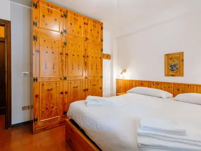 a bedroom with a bed with two towels on it at Apartment Apt 18 by Interhome in Campitello di Fassa