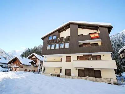 a large building with a gambrel roof at Apartment Apt 18 by Interhome in Campitello di Fassa