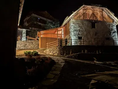 a house with a thatched roof at night at OBERBUCHFELDER historic farmhouse in Laion