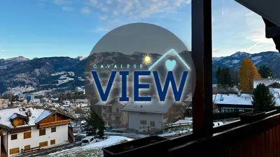 a view from a window with a view of a village view at Cavalese view in Cavalese