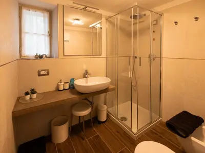 a bathroom with a sink and a shower at Casa La Montanina, a due passi dal centro di Cortina in Cortina dʼAmpezzo