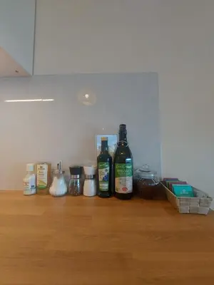 a kitchen counter with appliances on a wooden floor at Apartment Bergblick auf Bio-Hof in Merano