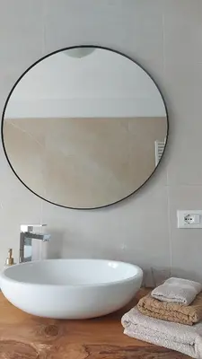 a white bathroom with a toilet and a sink at Apartment Bergblick auf Bio-Hof in Merano