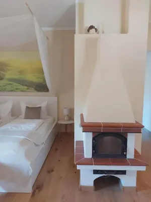 a bedroom with a bed and a tv at Apartment Bergblick auf Bio-Hof in Merano