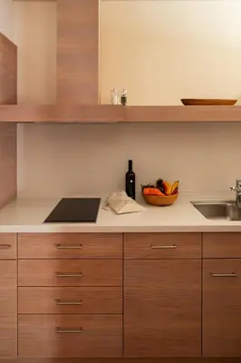 a kitchen counter with a sink and a bowl of fruit at Pergola Residence in Lagundo