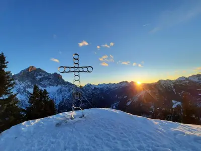a sign on the top of a snow covered mountain at Dolomites Apartment Finestra sul Civetta in Alleghe