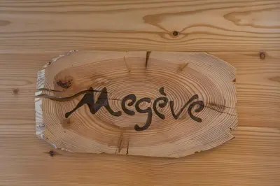 a wooden table with the word mercy written on it at Residence Aspen in Arabba