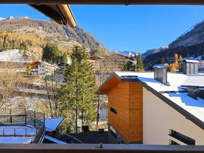 a view from the roof of a building with snow at Le Vette di Moena - Alpine Stay Apartments in Moena