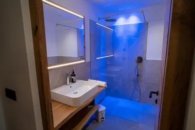 a bathroom with a sink and a shower at Lanzenschuster in San Genesio Atesino
