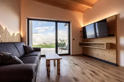 a room with a bench and a window at Stabingerhof Chalets & Apartment-Farm stay in Bressanone