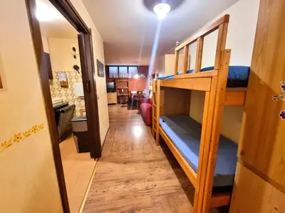 a hallway with bunk beds in a room at Licia in Canazei