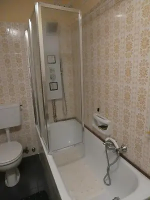 a bathroom with a shower and a toilet at Licia in Canazei