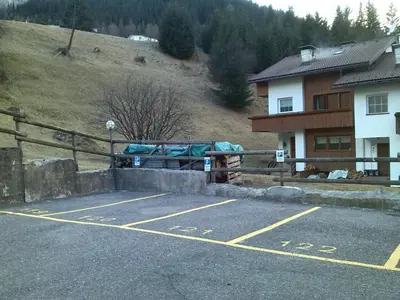a parking lot in front of a house at Licia in Canazei