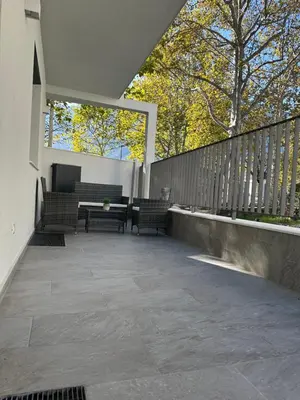 a living room with a couch and a table at Villa Hajdi Q & U in Merano