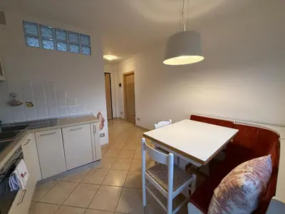 a white bathroom with a sink and a toilet at Vista Rosengarten in Bolzano