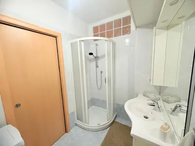 a bathroom with a shower and a sink at Vista Rosengarten in Bolzano