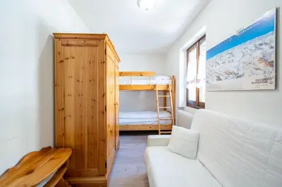 a living room with a couch and a bunk bed at Cesa de Paio in Mazzin