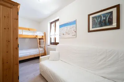 a living room with a couch and a bunk bed at Cesa de Paio in Mazzin