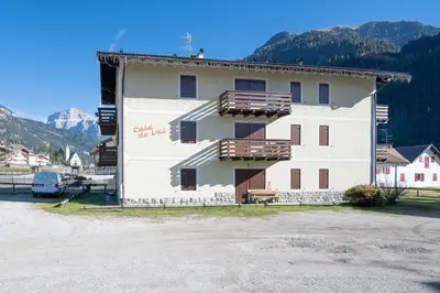 a building with a sign on the side of it at Cesa de Paio in Mazzin