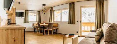 a living room with a couch and a table at Apartments Broslhof in Racines