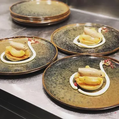 a group of plates of food on a table at Design Hotel Tyrol in Rablà
