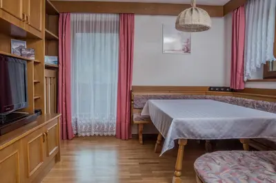 a book sitting on top of a table at Apartment - Alpin Chalet Frenademetz in San Martino in Badia