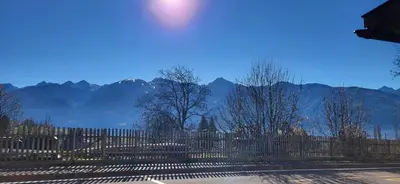 a fence with mountains in the background at Casa Clo' in Varena