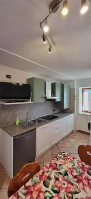 a kitchen with a sink and a counter top at Casa Clo' in Varena
