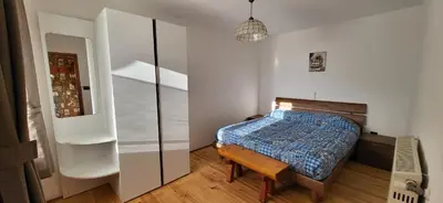 a bedroom with a bed and a glass closet at Casa Clo' in Varena