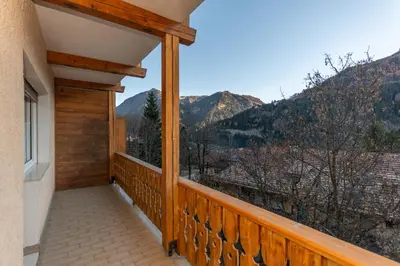 a balcony with a view of the mountains at Appartamento Lucia 201 in Vigo di Fassa
