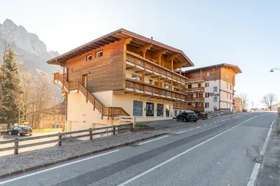 a building on the side of a road at Appartamento Lucia 201 in Vigo di Fassa