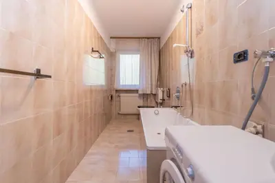 a bathroom with a toilet and a sink and a shower at Appartamento Alessandra 106 in Vigo di Fassa