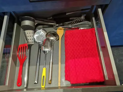 a drawer full of utensils with a red napkin at Ciasa Sabine in Antermoia