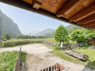 a view of a field with mountains in the background at Chalet Vernel in Canazei