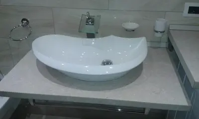 a white sink on a counter in a bathroom at Azalea in Canazei