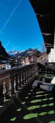 a balcony of a building with a view of a city at Azalea in Canazei