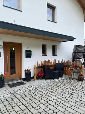 a house with a fence and a patio at Grasspeintenhof Reiterhof in Falzes