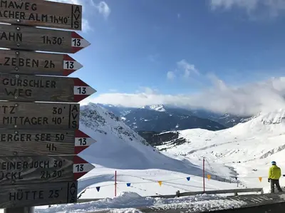 a directional sign at the top of a ski slope at Thermae Apartment in Merano