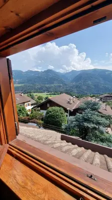 a window view of a mountain view from a house at Chalet Genziana in Cavalese