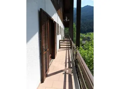 a balcony of a building with a view of a mountain at Moena Appartamento Fior di Melo con WiFi e Riscaldamento in Moena