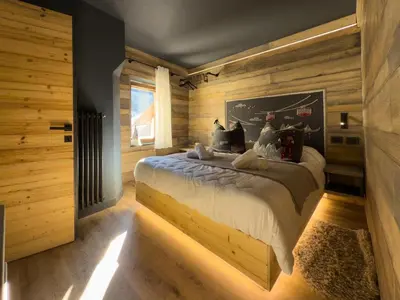 a bedroom with a bed with christmas decorations on it at Duo Charme in Moena