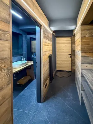 a bathroom with a sink and a tub and a toilet at Duo Charme in Moena