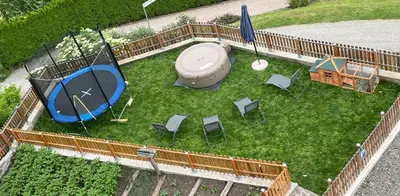 an aerial view of a yard with a tent and chairs at Austillerhof - Urlaub auf dem Bauernhof in Funes