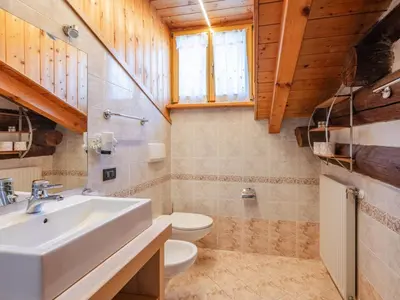 a bathroom with a sink and a toilet at Apartment Casa Costazzer A by Interhome in Mazzin