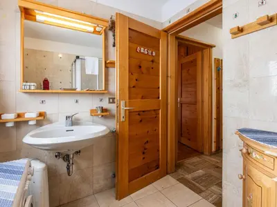a bathroom with a sink and a mirror at Apartment Fontanelle-3 by Interhome in Alba di Canazei