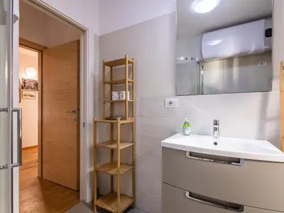 a bathroom with a sink and a mirror at Apartment Cesa Giordi by Interhome in Canazei