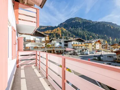 a balcony with a view of a town at Apartment Cesa Giordi by Interhome in Canazei